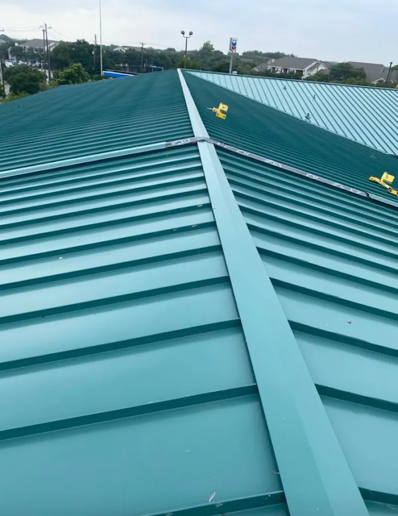 Green commercial metal roof ridge and valley for Metal Roof Repair in Lake Park